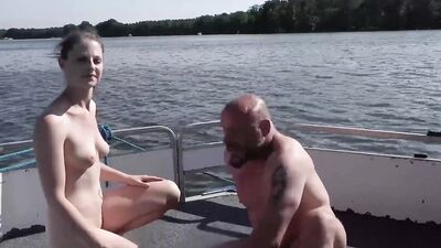 Outdoor sex on the boat, her wet pussy glistening in the sun