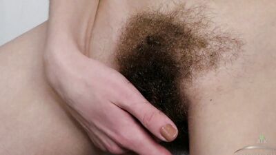 Lillian slips into the bath and fingers her wet hairy pussy