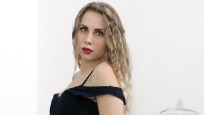 Margaret strips out of her dress and slips her fingers inside her hairy cunt