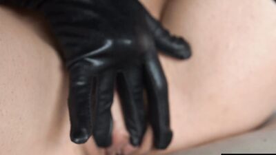 Gloved fingers and a vibrator give her such a powerful orgasm