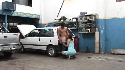 Hot brunette babe with hairless pussy takes a cumshot from mechanic after deepthroating and banging him