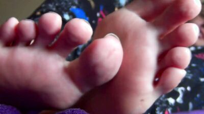Watch this stunning brunette babe ignore her toes and play with her long, long feet up close and personal