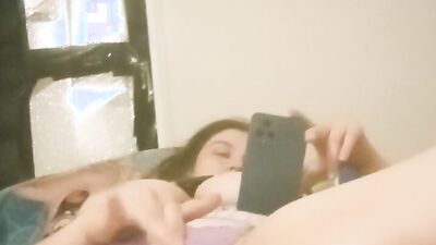 Watch this busty amateur babe orgasm while watching porn with her big tits and wet pussy