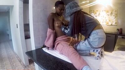 Watch these wild black college babes caught scissoring on the kitchen counter