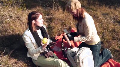 Naughty lesbians enjoy outdoor strapon play with tender kisses and pussy licking
