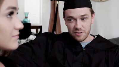 Two college graduates are enjoying intimate time after their final class