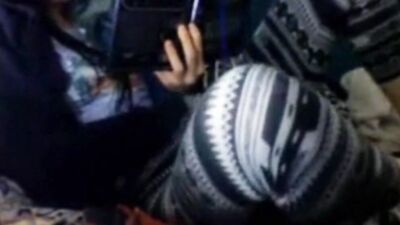 Hidden camera caught an amateur chick rubbing her pussy while reading an erotic novel