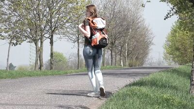 Young hitchhiking girl pays the driver by giving him a blowjob and her pussy