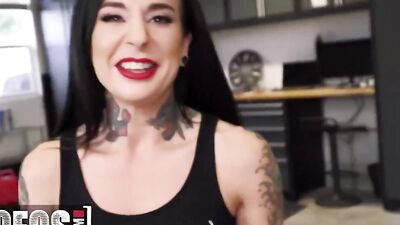 Inked harlot is sucking off and banging a biker in his shop