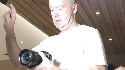 Grandad is taking pictures of two young babes before getting a blowjob from them