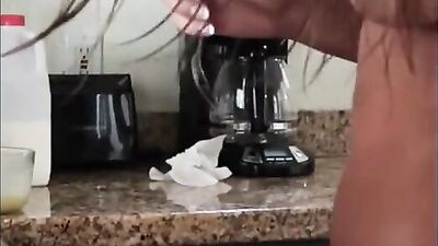 Amateur cooze is preparing breakfast in her kitchen while being completely nude