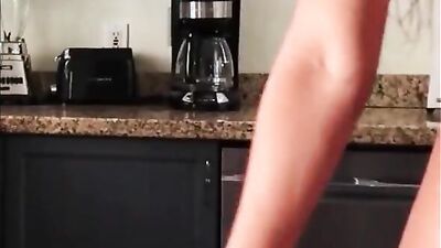 Amateur cooze is preparing breakfast in her kitchen while being completely nude