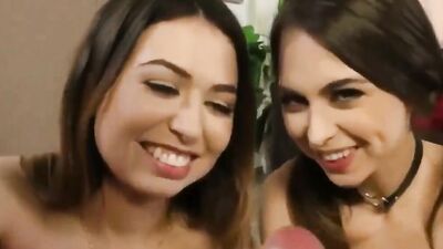 Two college chicks are playing with a cock of their buddy