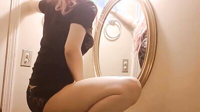 Pink-haired teen is filming herself while rubbing her twat in a bathroom
