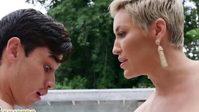 Short-haired blonde can't get enough of a teen stallion and his massive schlong