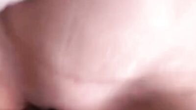 A close-up on an amateur lady while she's stuffing her mouth with a thick johnson