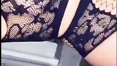 Lady in sexy black lingerie is using a dildo on her itching pussy
