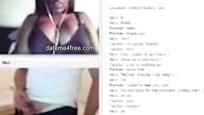 Amateur ebony cougar is teasing a white bloke with her boobs while he's masturbating
