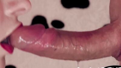 A close-up on an amateur chick while she's sucking off a big cock
