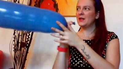 Big ass redhead woman is getting naked and playing with huge balloons