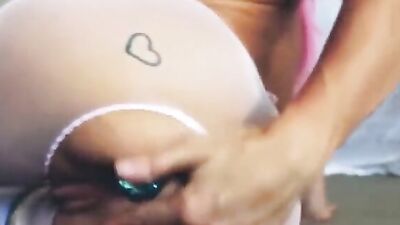 Amateur hussy tries out a couple of lovely butt plugs on her ass