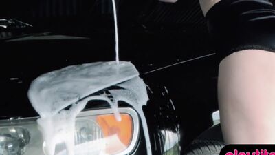 Enjoy a smoking hot busty babe who is washing a car topless