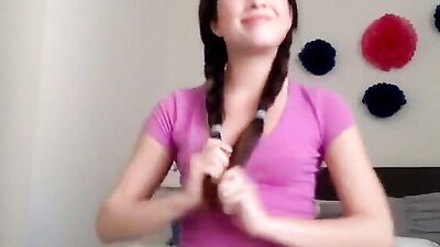 Lovely teen girl enjoys dildoing her pussy on a web camera