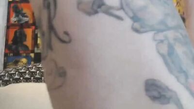 Tattooed camgirl has a couple of sex toys she loves using on her snatch