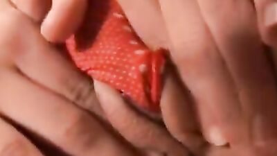 Solo brunette minx is using a lolly for sucking and pussy rubbing