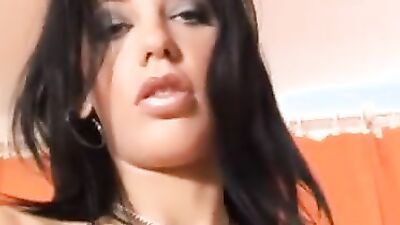 Solo brunette minx is using a lolly for sucking and pussy rubbing