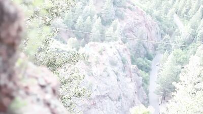 Lonely ginger doll is filmed while using a magic wand outdoors