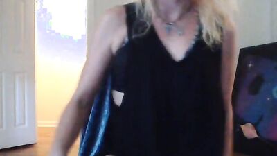 Amateur blonde performs a striptease before toying her bald snatch