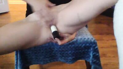Amateur blonde performs a striptease before toying her bald snatch