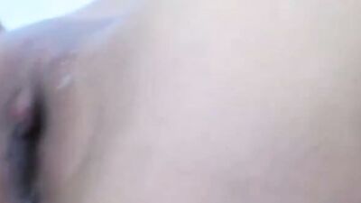 Solo brunette with big natural boobs is rubbing her twat with a sex toy